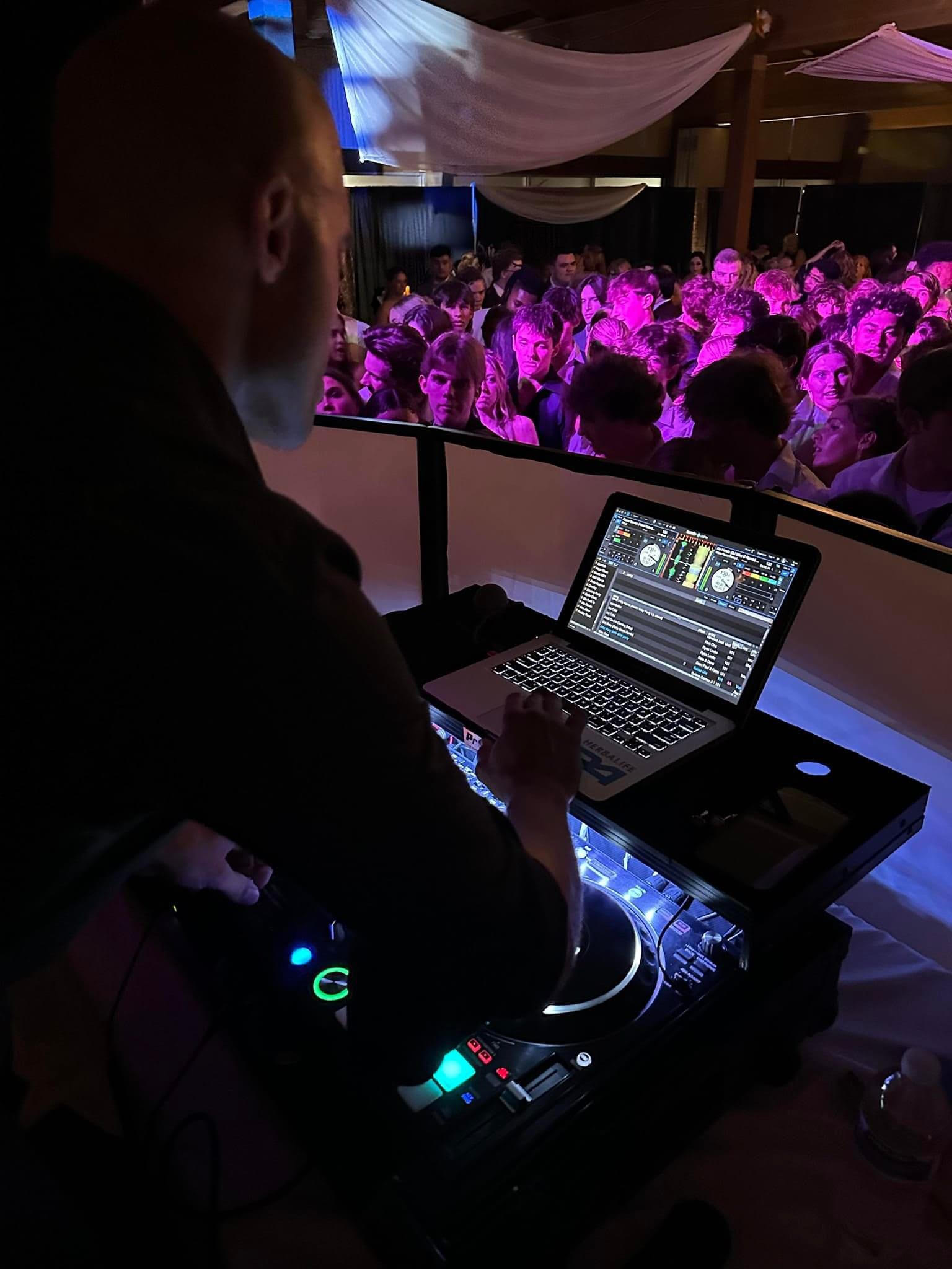 An image of a wedding DJ party.